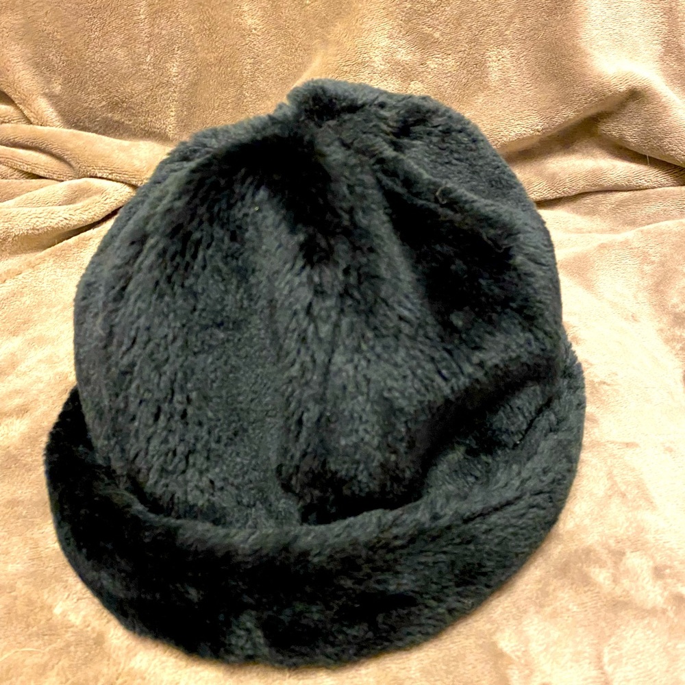 Fits large head. Faux fur hat.